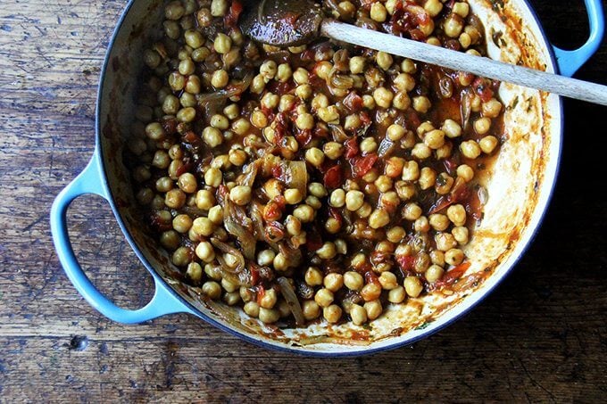 A Le Creuset braiser filled with chickpea tagine and tomato jam.