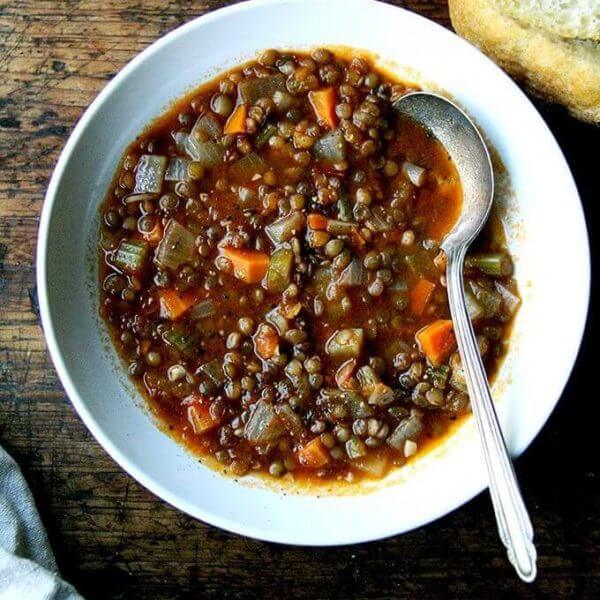 A bowl of one-pot vegan lentil soup.