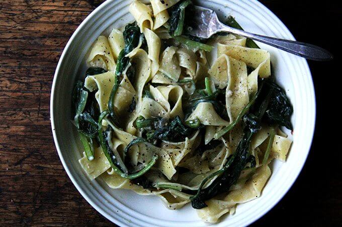 A bowl of no-bacon carbonara loaded with greens.