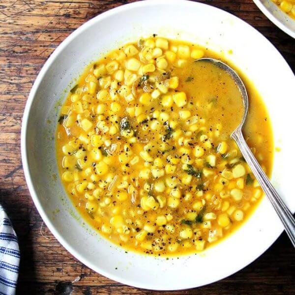 A bowl of curried coconut corn soup.