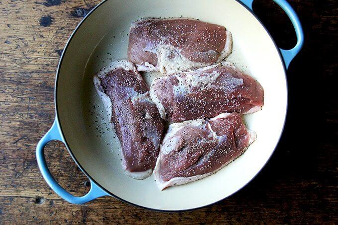 Four duck breasts, skin side down in a roasting pan. 