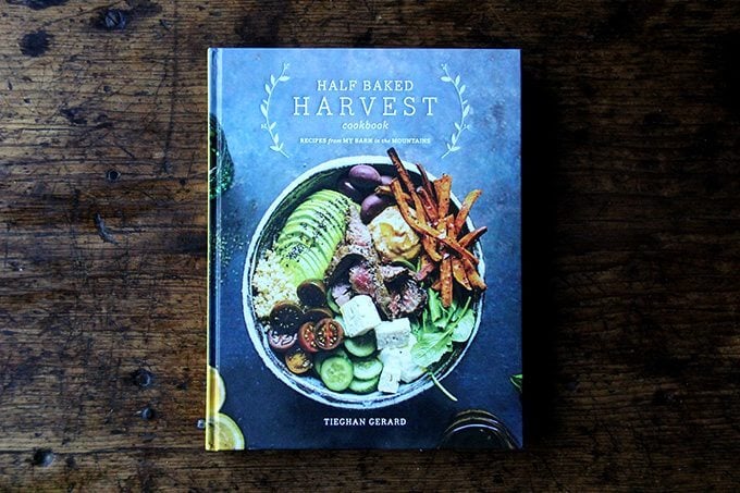 The half baked harvest cookbook on a table.