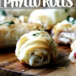 Salami and provolone phyllo rolls on a board.