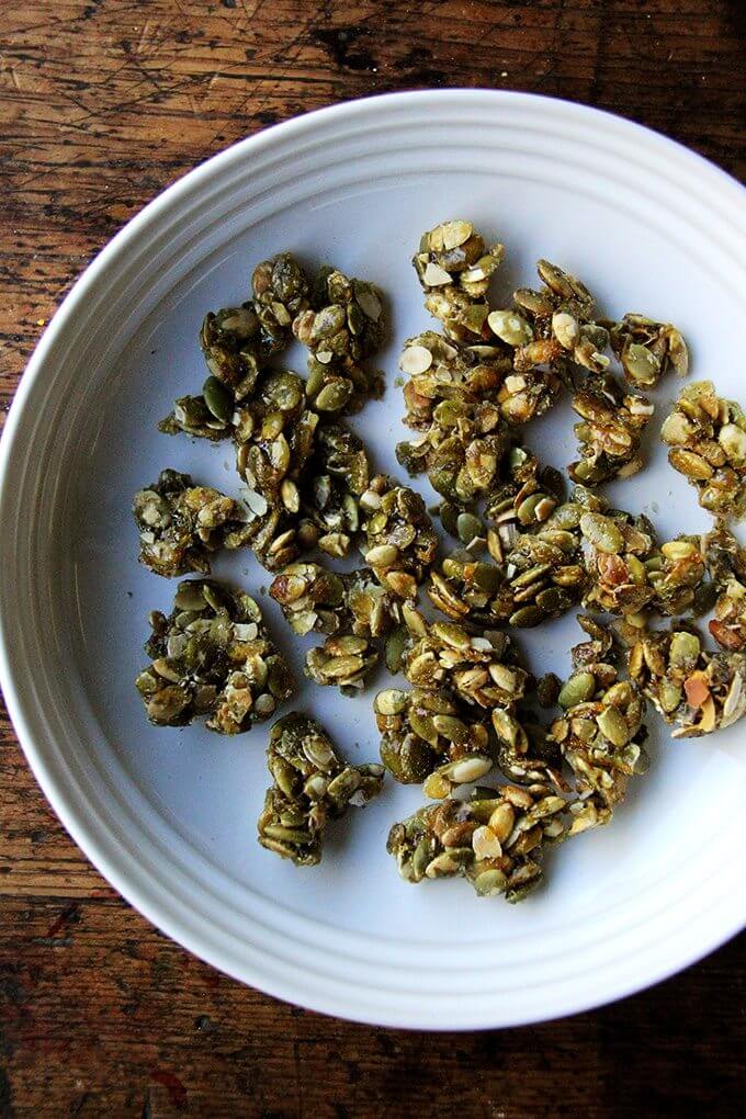 A plate of candied pumpkin seeds. 