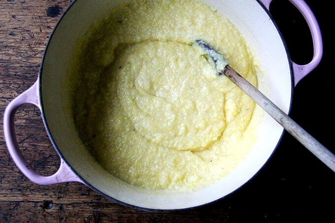 A Dutch oven filled with creamy oven-roasted polenta.