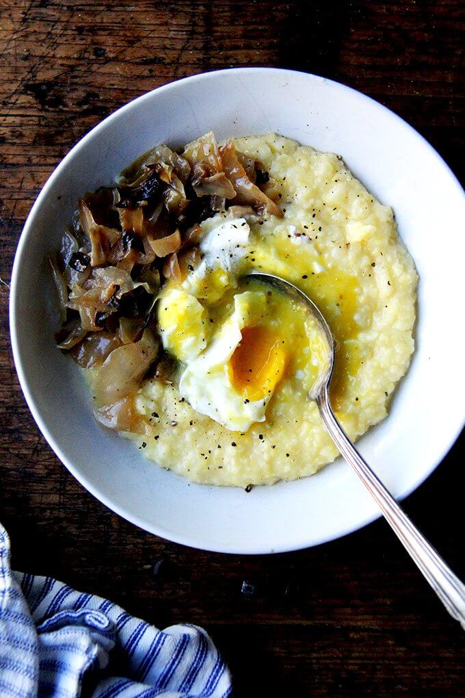 Friends, roasting polenta in the oven is a game changer — it frees up your cooktop and, more important, YOU. While the polenta bubbles away in the oven, you can sauté greens or poach eggs or steam broccoli or take a bath give the kids a bath, etc. No need to worry if the polenta is sticking to the pot, running out of liquid—in the oven it cooks slowly and evenly. It's the easiest thing in the world, and this time of year, I could eat it with everything // alexandracooks.com