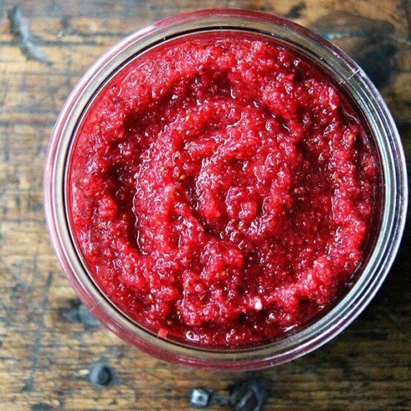 An overhead shot of a jar filled with no-cook cranberry sauce.