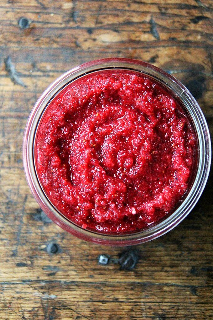 An overhead shot of a jar filled with no-cook cranberry sauce. 