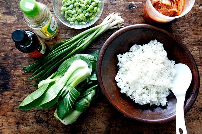 A bowl of cooked rice on a table.