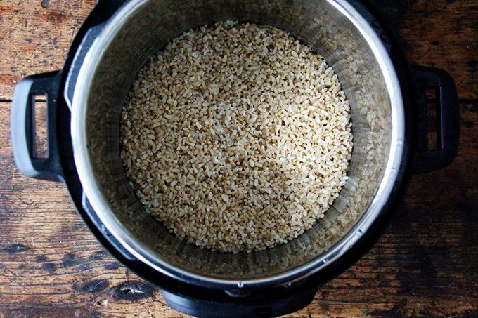 An uncovered Instant pot filled with perfectly cooked Instant Pot brown rice.