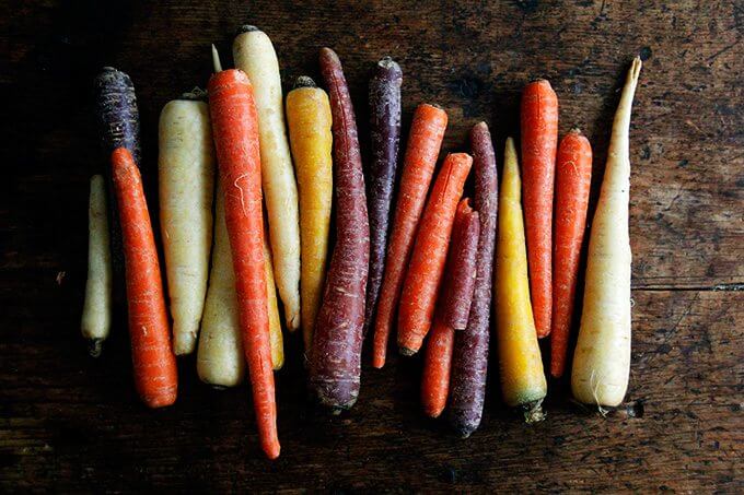 A board with an array of multi-colored carrots.