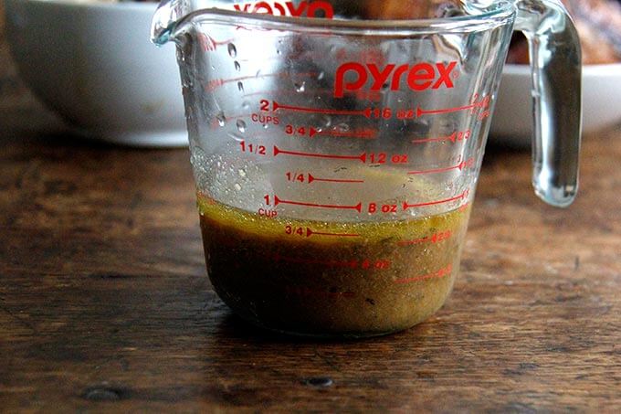 Pyrex with sauce and fat rising to the top. 