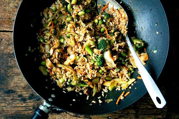 A wok filled with Kimchi fried rice.