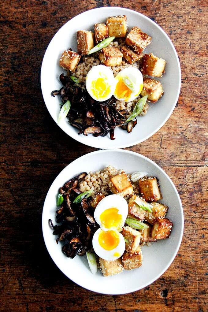 A bowl of brown rice, crispy tofu and mushrooms, and perfect instant pot soft-boiled eggs.