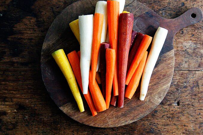 Peeled carrots on a board.