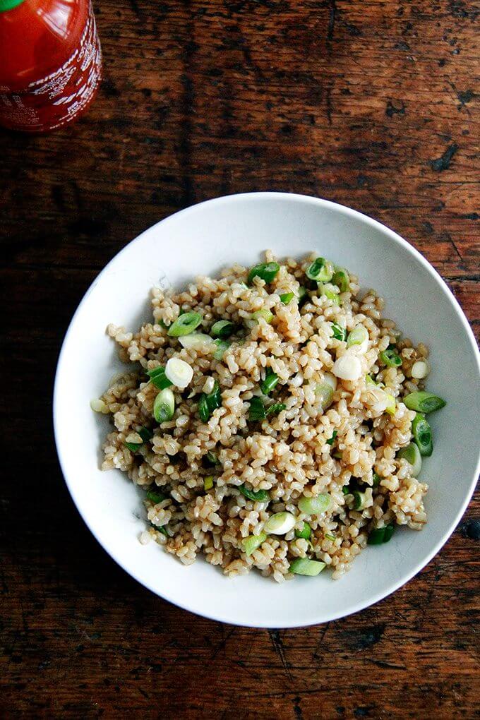 A bowl of perfectly cooked and seasoned Instant Pot brown rice. 