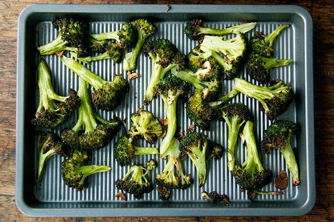 A sheet pan of roasted broccoli. 