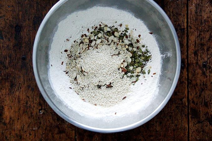 Dry ingredients for three seed crackers all mixed together in a bowl. 