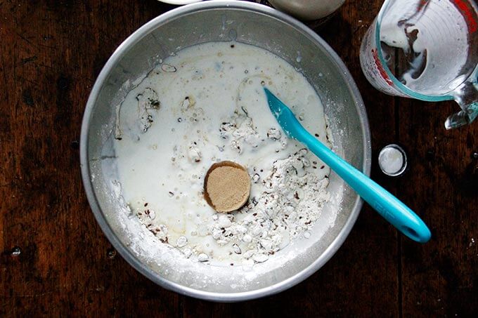 Wet ingredients added to bowl of dry ingredients for 3-seed crackers. 