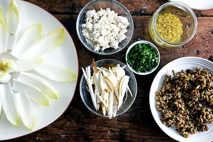 All of the components for the endive boats on a table. 