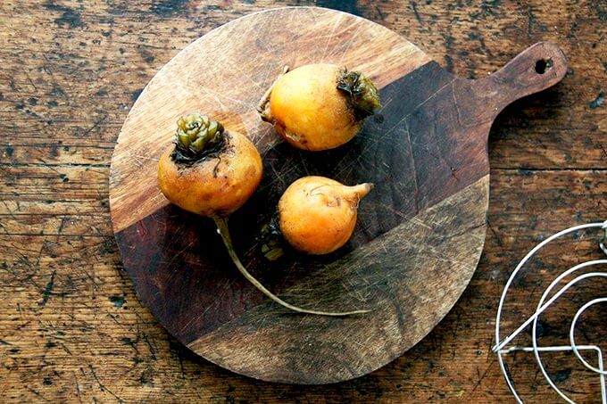 Cooked beets on a board. 