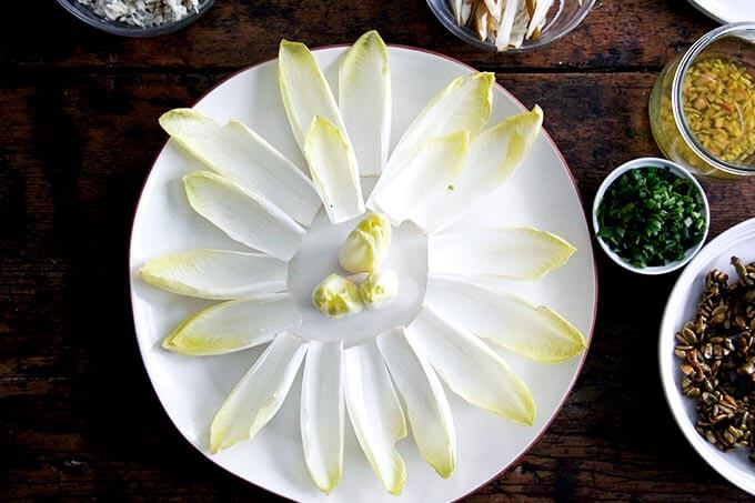 A platter of endive leaves arranged on a platter.