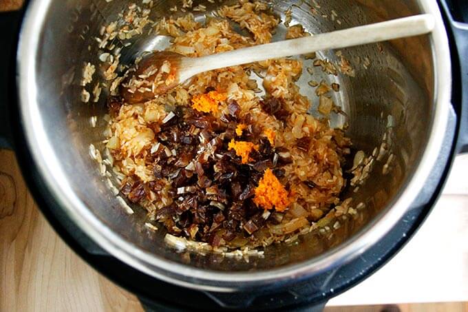 An Instant Pot with Moroccan Rice with dates and orange in the making. 
