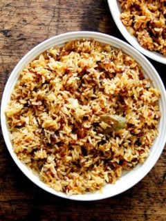 A bowl of Moroccan Rice with dates and harissa.
