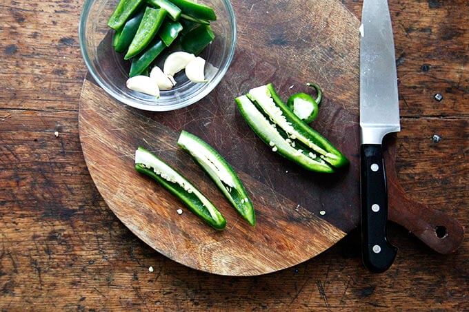 A hot chili on a cutting board.