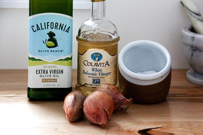 Ingredients for shallot vinaigrette: olive oil, white balsamic, shallots, and salt.