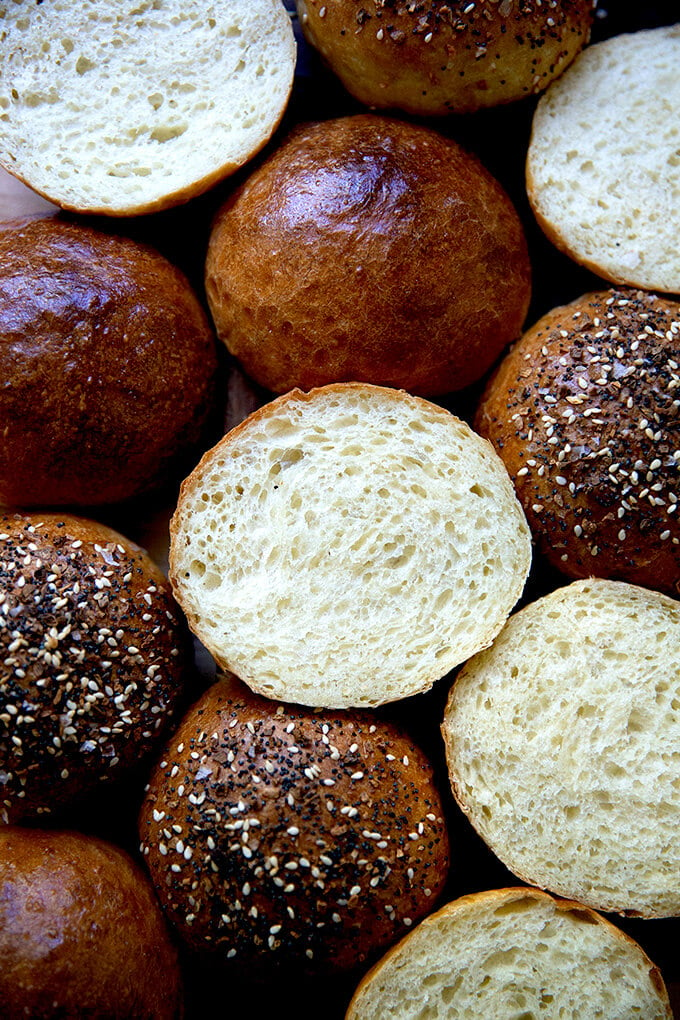 Halved Brioche buns on a board.