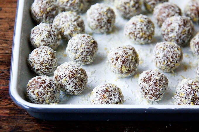 A tray of lemon coconut date balls. 