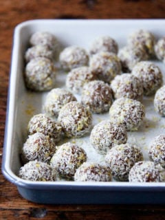 A tray of lemon-coconut date balls.