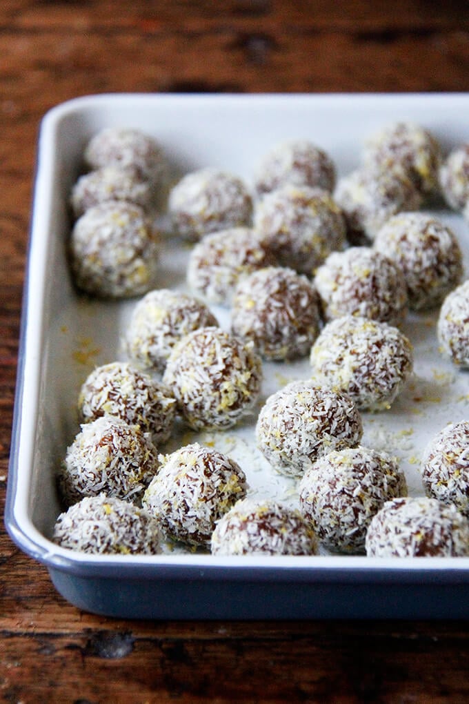 A tray of lemon-coconut date balls.