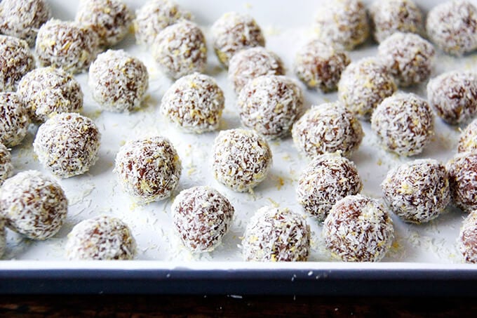 A tray of lemon coconut date balls. 