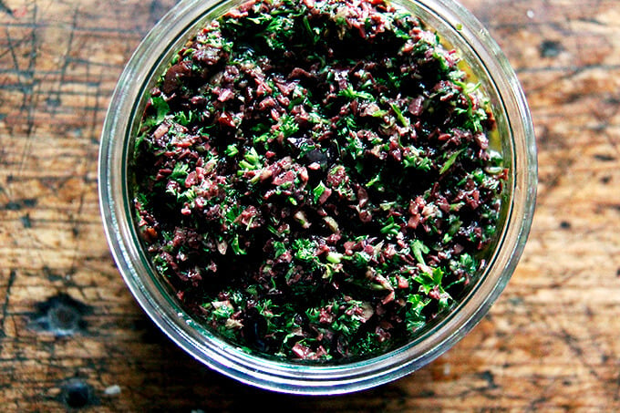 A bowl of black olive tapenade. 