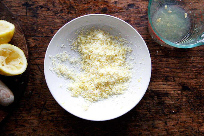 A bowl of lemon zest and coconut mixed together.