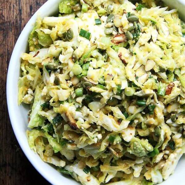 A bowl of cabbage salad with miso-carrot dressing.