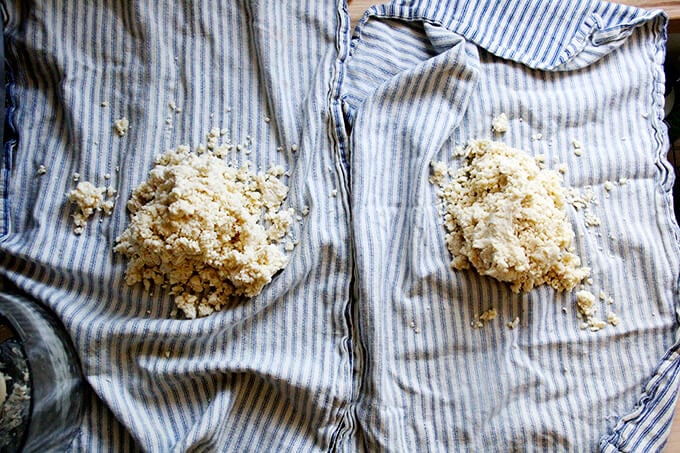 Two tea towels filled with just-pulsed food processor pastry dough. 