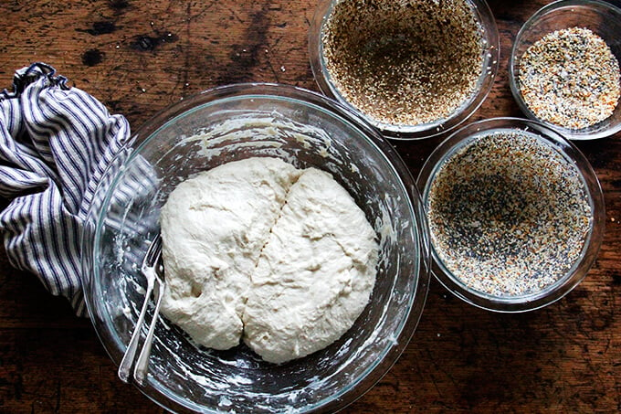 A bowl with dough split into two portions. 