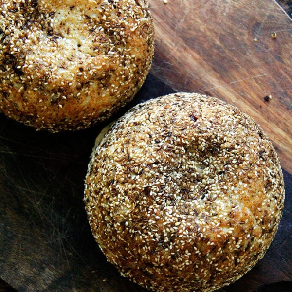 A board with freshly baked dukkah bread on top.