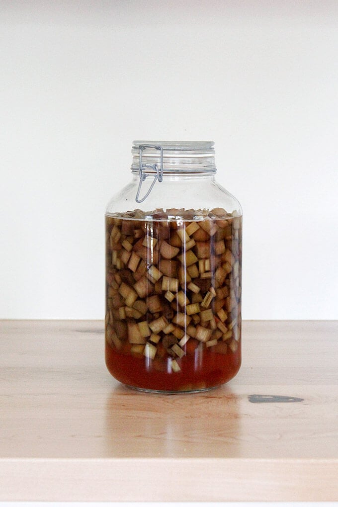 A large jar of rhubarb schnapps. 