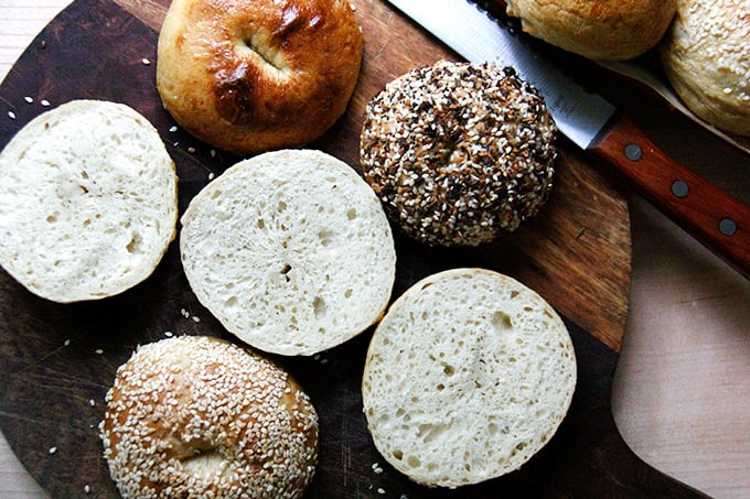 Halved bagels on board. 