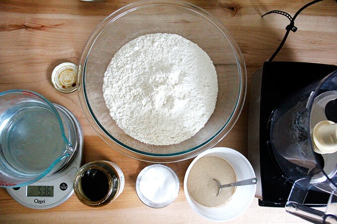 A counter with bagel-making ingredients. 