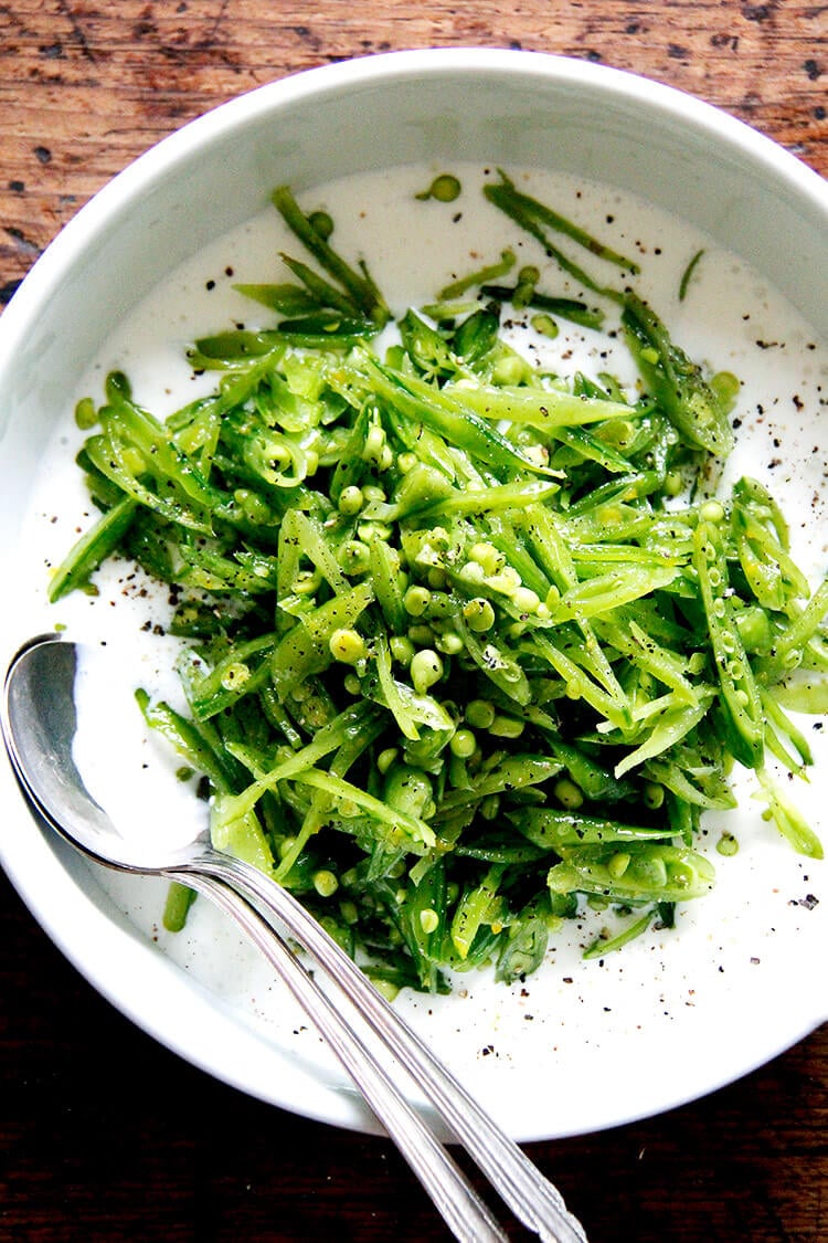 Sugar snap pea salad with shaved onion, radish, basil, and mint