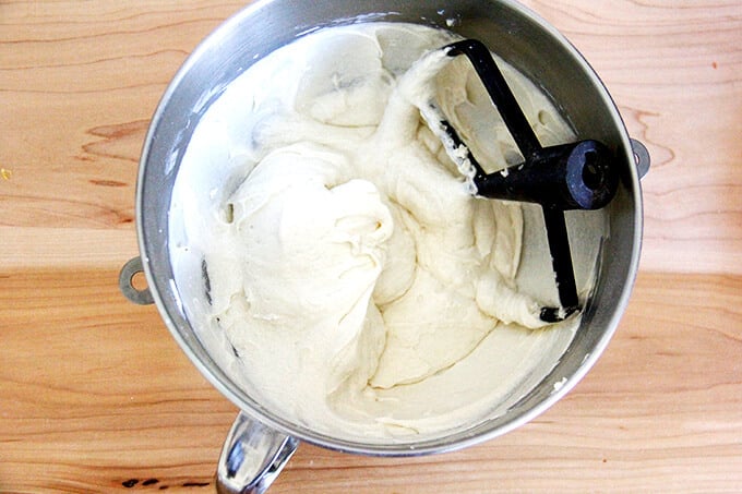 An overhead shot of a stand mixer with the batter for the apple cobbler all beaten up. 