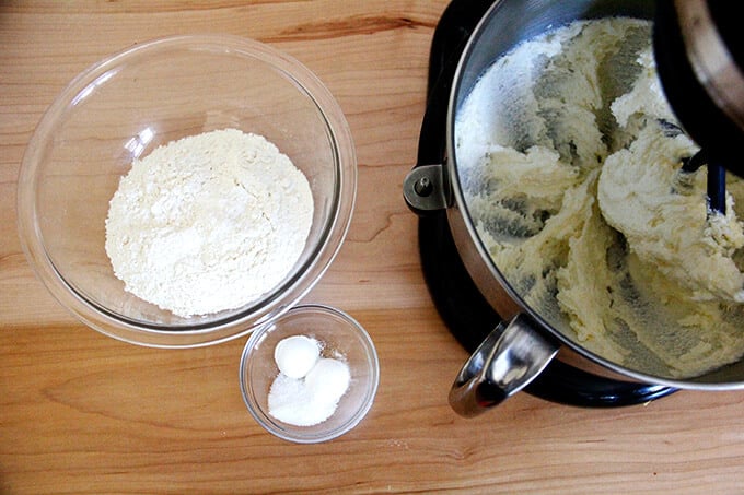 An overhead shot of a stand mixer beating butter.