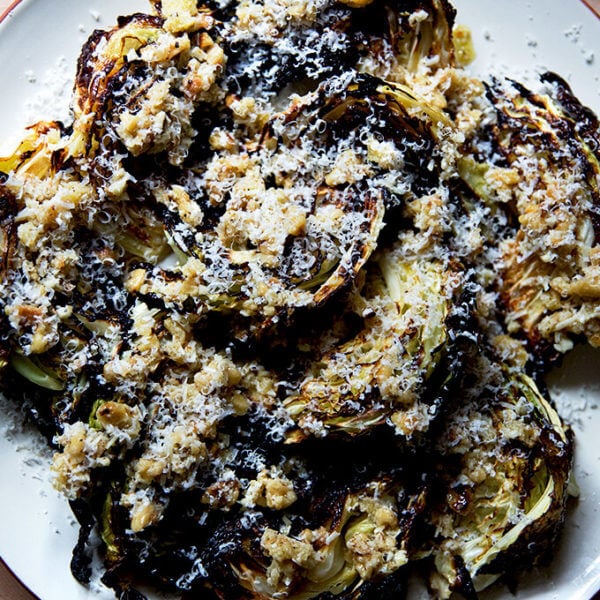 a plate of roasted cabbage wedges with walnuts, parmesan, bread crumbs and balsamic.