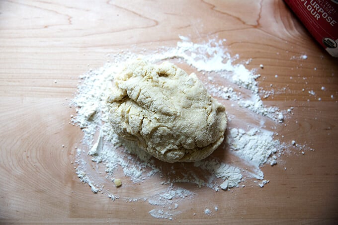 Chinese steamed scallion bun dough on a floured counter top. 