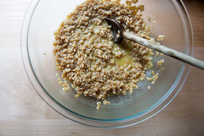 A bowl of farro tossed with a lemon dressing in a bowl.
